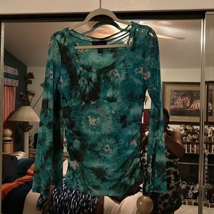 This blouse is by INC and is rich in color, just gorgeous. Excellent in size L.